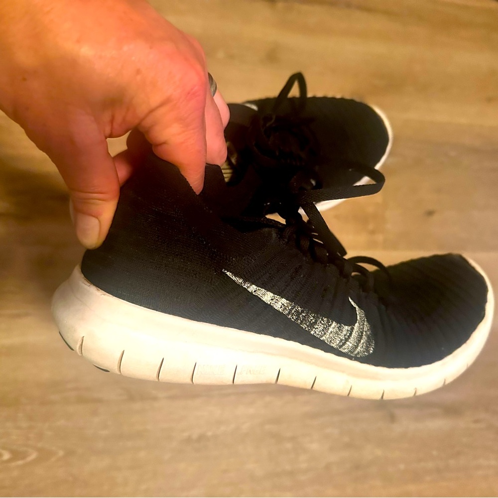 Nike free run flyknit black with white trim!